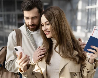 medium-shot-couple-looking-phone